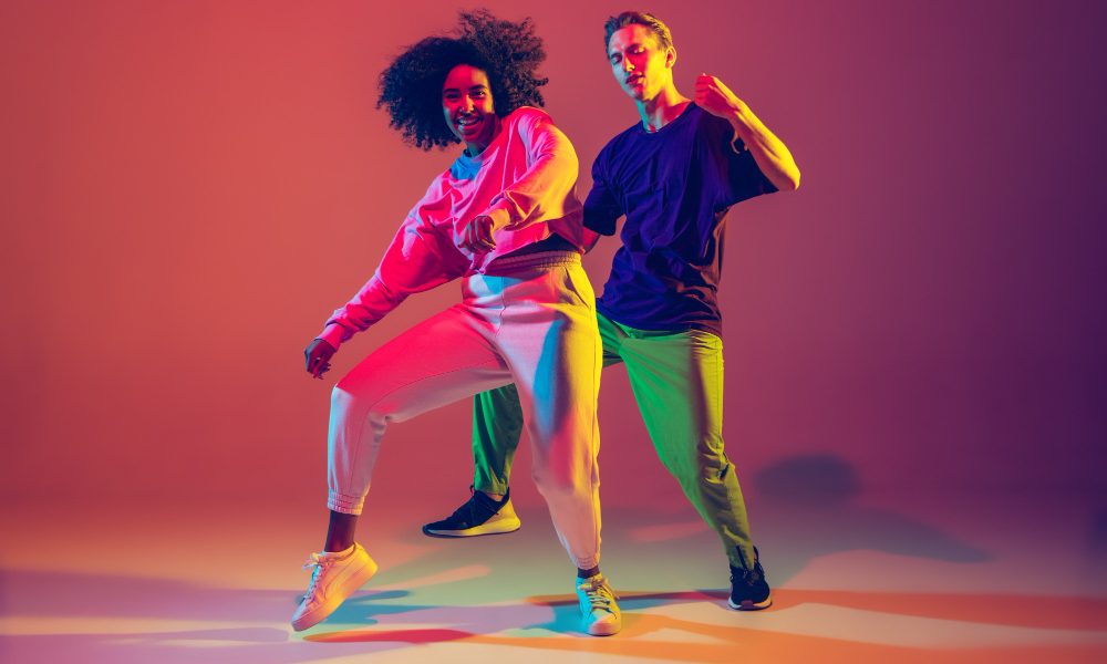 dance-time-stylish-men-woman-dancing-hip-hop-bright-clothes-green-background-dance-hall-neon-light